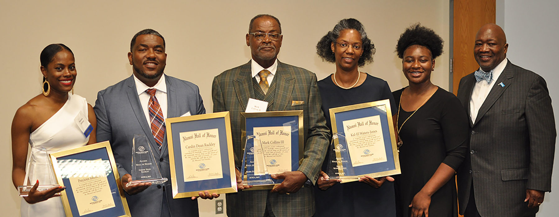 Cardin “Dean” Rackley and other Alumni Hall of Famers holding their Boys & Girls Club awards