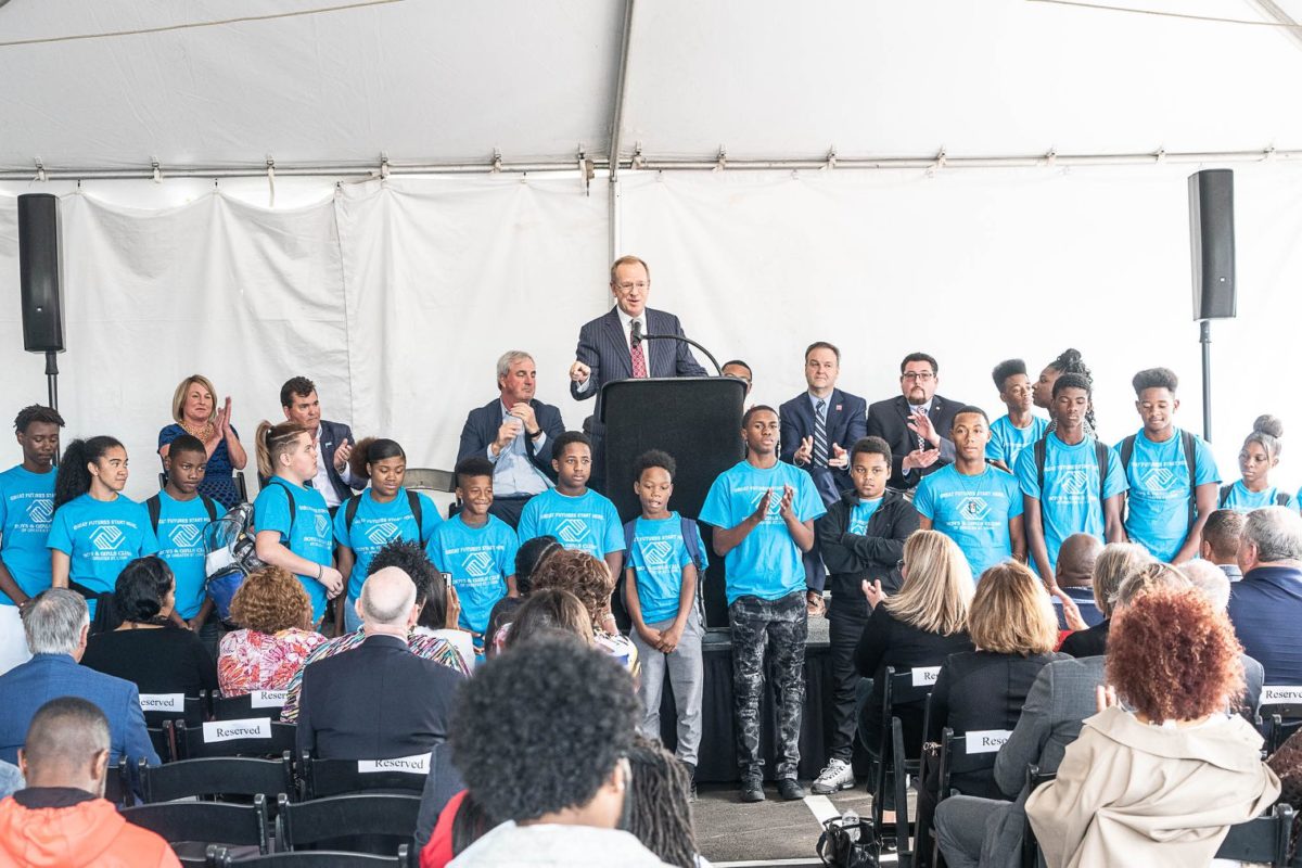 Man giving a speech at the Teen Center of Excellence ribbon cutting ceremony